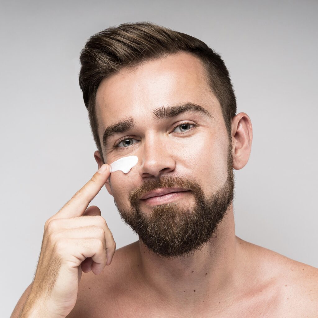 man using face cream
